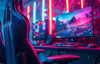 Een moderne gamingwerkplek met een monitor, toetsenbord en gamingstoel in opvallende neonverlichting.